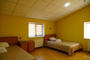 Postel nebo postele na pokoji v ubytování Hotel Nova