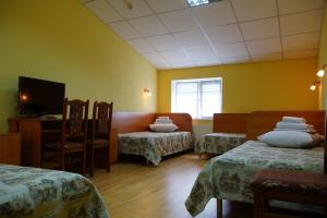 Postel nebo postele na pokoji v ubytování Hotel Nova