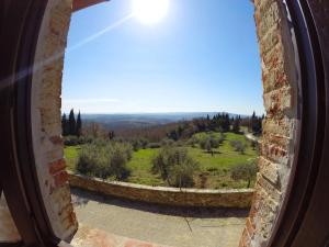 a view of a field from a window at Candido Apartment in Vagliagli