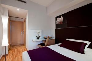 Voodi või voodid majutusasutuse Hotel Gravina San Pietro toas