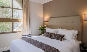 מיטה או מיטות בחדר ב-A23 מלון בוטיק