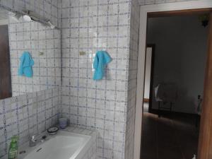 a bathroom with a sink and a mirror at Casa do Rei in Furnas +29 photos