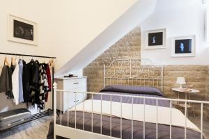 a bedroom with a bed and a staircase at Casa Nerina in Scicli
