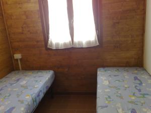 Postel nebo postele na pokoji v ubytování Camping Luni