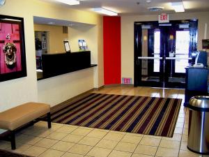 a lobby with a waiting room with a exit sign on the wall at Extended Stay America Suites - Minneapolis - Airport - Eagan - South in Eagan