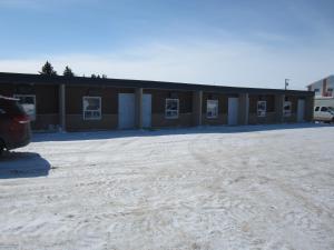 an empty parking lot in front of a building at Shoal Lake Motor Inn in Shoal Lake