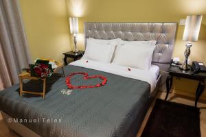 Uma cama ou camas num quarto em Hotel Tulipa