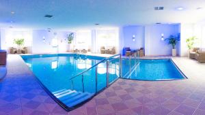 a large swimming pool in a hotel room at The Royal Duchy Hotel in Falmouth