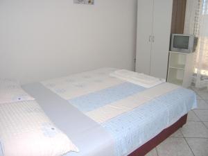 Postel nebo postele na pokoji v ubytování Apartments Murgic