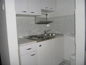 Kuchyň nebo kuchyňský kout v ubytování Apartments Murgic