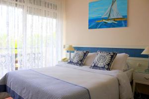 Cama ou camas em um quarto em Hotel San Martin
