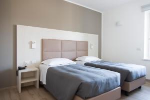 A bed or beds in a room at Albergo Ristorante Belvedere