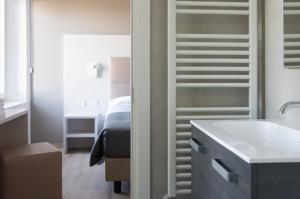 A bed or beds in a room at Albergo Ristorante Belvedere