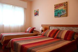 Cama ou camas em um quarto em Hotel San Martin