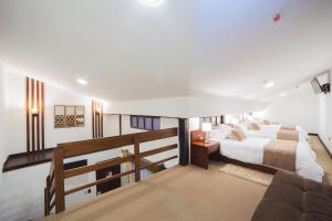 Ένα ή περισσότερα κρεβάτια σε δωμάτιο στο Felicia Hotel & Suites +19 φωτογραφίες