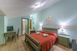 A bed or beds in a room at Il Raduno