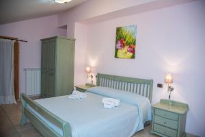A bed or beds in a room at Il Raduno