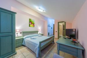 A bed or beds in a room at Il Raduno
