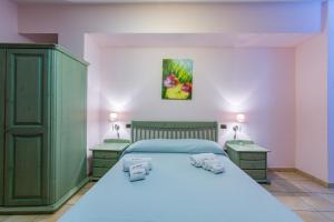 A bed or beds in a room at Il Raduno