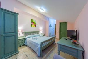 A bed or beds in a room at Il Raduno