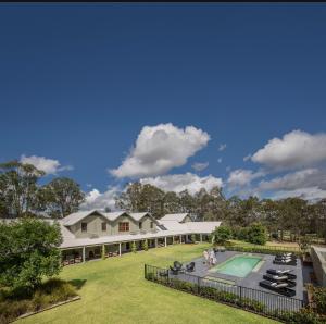 an aerial view of a house with a swimming pool at Spicers Vineyards Estate in Pokolbin