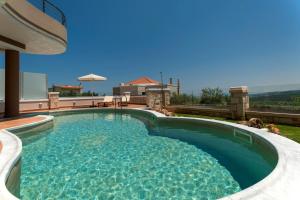 a swimming pool in the middle of a house at Villa Stellina in Marathokefála