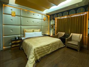Tempat tidur dalam kamar di Lai Yin Motel