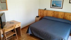 Postel nebo postele na pokoji v ubytování Albergo Le Rose