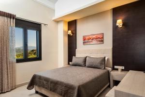 a bedroom with a bed and a window at Villa Stellina in Marathokefála +19 photos