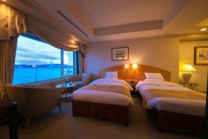Postel nebo postele na pokoji v ubytování Seaside Hotel Maiko Villa Kobe