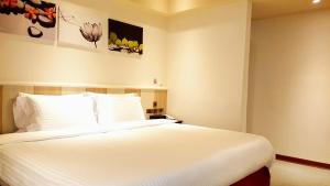 Postel nebo postele na pokoji v ubytování Macchi Hotel - Taipei