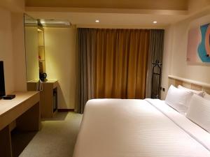 Postel nebo postele na pokoji v ubytování Macchi Hotel - Taipei