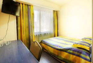 Voodi või voodid majutusasutuse Tsaghkahovit Hotel toas