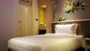 Postel nebo postele na pokoji v ubytování Macchi Hotel - Taipei
