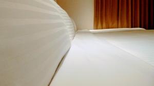 Postel nebo postele na pokoji v ubytování Macchi Hotel - Taipei
