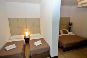 Postel nebo postele na pokoji v ubytování Hotel San Giuliano