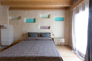 A bed or beds in a room at Sempreverde Atelier B&B