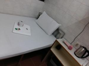 Příslušenství pro přípravu čaje a kávy v ubytování New Yan Yan Guest House reception 9th floor Flat E4 E6 + 20 fotografií
