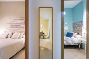 Postel nebo postele na pokoji v ubytování Apartamentos Diaber San Leandro