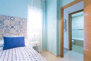 Postel nebo postele na pokoji v ubytování Apartamentos Diaber San Leandro