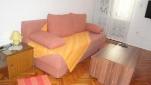 a living room with a couch and a table at Villa Bencun in Medulin