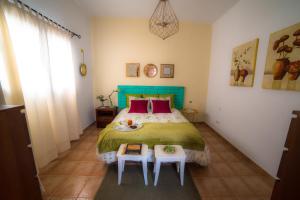 Ένα ή περισσότερα κρεβάτια σε δωμάτιο στο Casa El Cerco