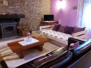 a living room with a couch and a fireplace at Dukebaso in Durango