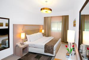 Posteľ alebo postele v izbe v ubytovaní Toledo Amman Hotel