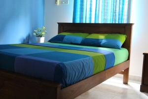Ένα ή περισσότερα κρεβάτια σε δωμάτιο στο Colombo Airport Homestay