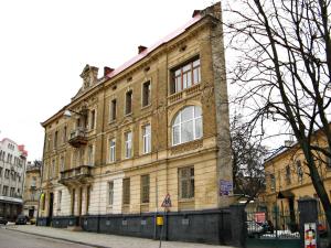 a large brick building on the side of a street at New York Hostel in Lviv