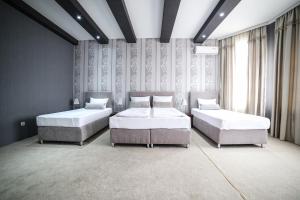 Postel nebo postele na pokoji v ubytování Garni Hotel Radović + 37 fotografií
