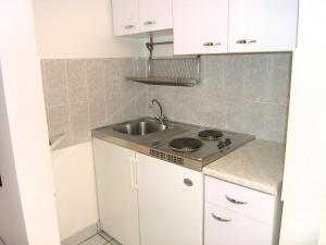 Kuchyň nebo kuchyňský kout v ubytování Apartments Murgic