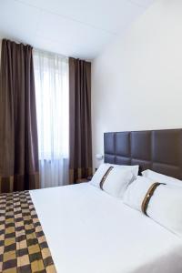 Łóżko lub łóżka w pokoju w obiekcie Best Western Hotel Libertà