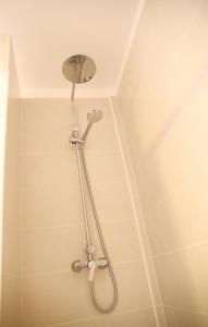 a shower with a shower head in a bathroom at Apartamento en Santa Cruz de La Palma in Santa Cruz de la Palma +29 photos